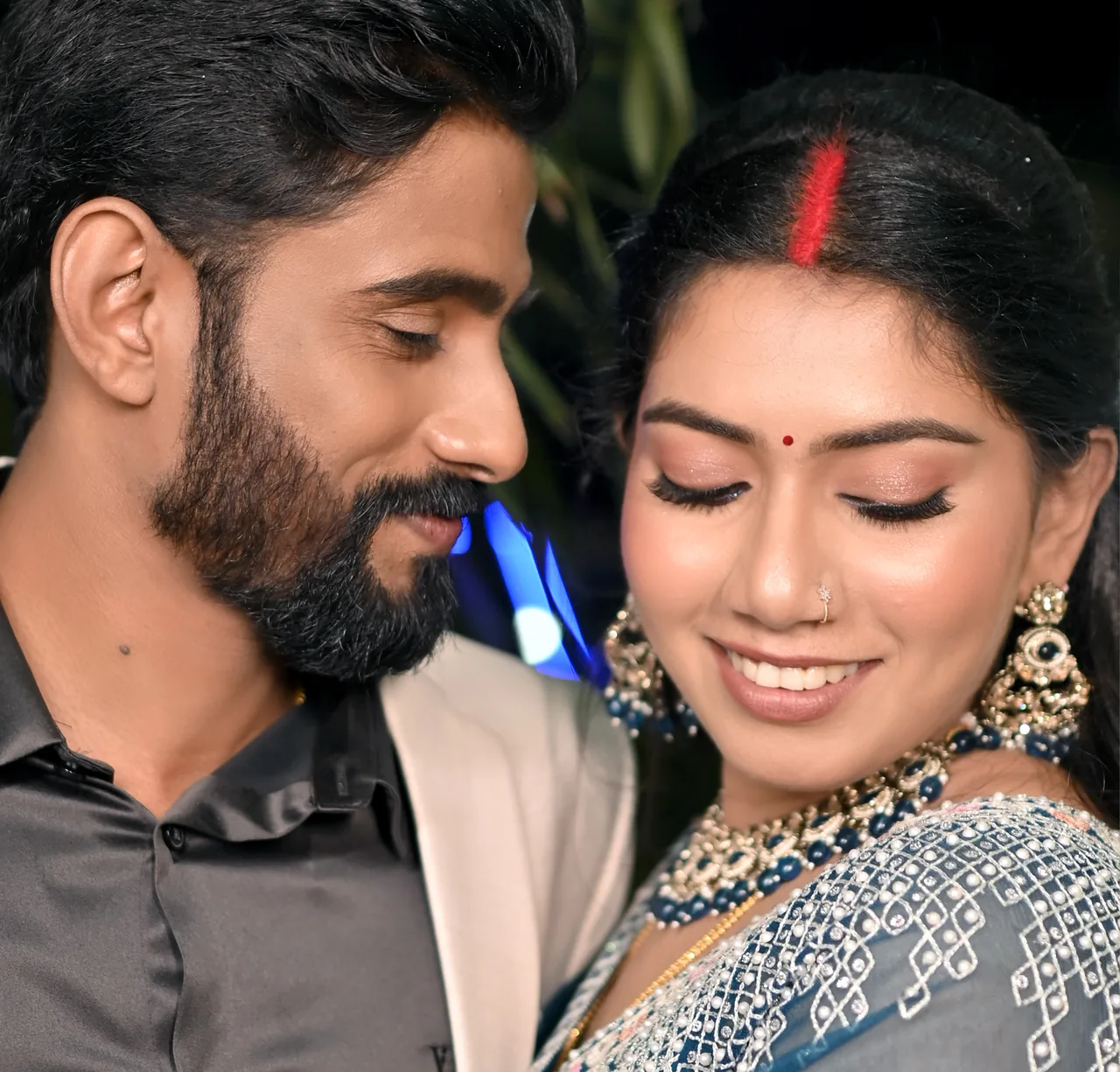 Couple smiling together, cheek to cheek